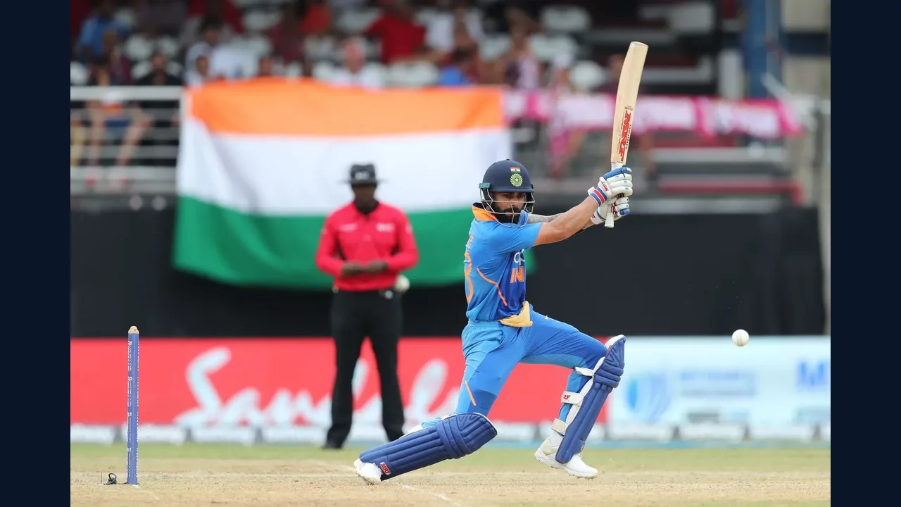 Cricket batsman playing a shot in a stadium
